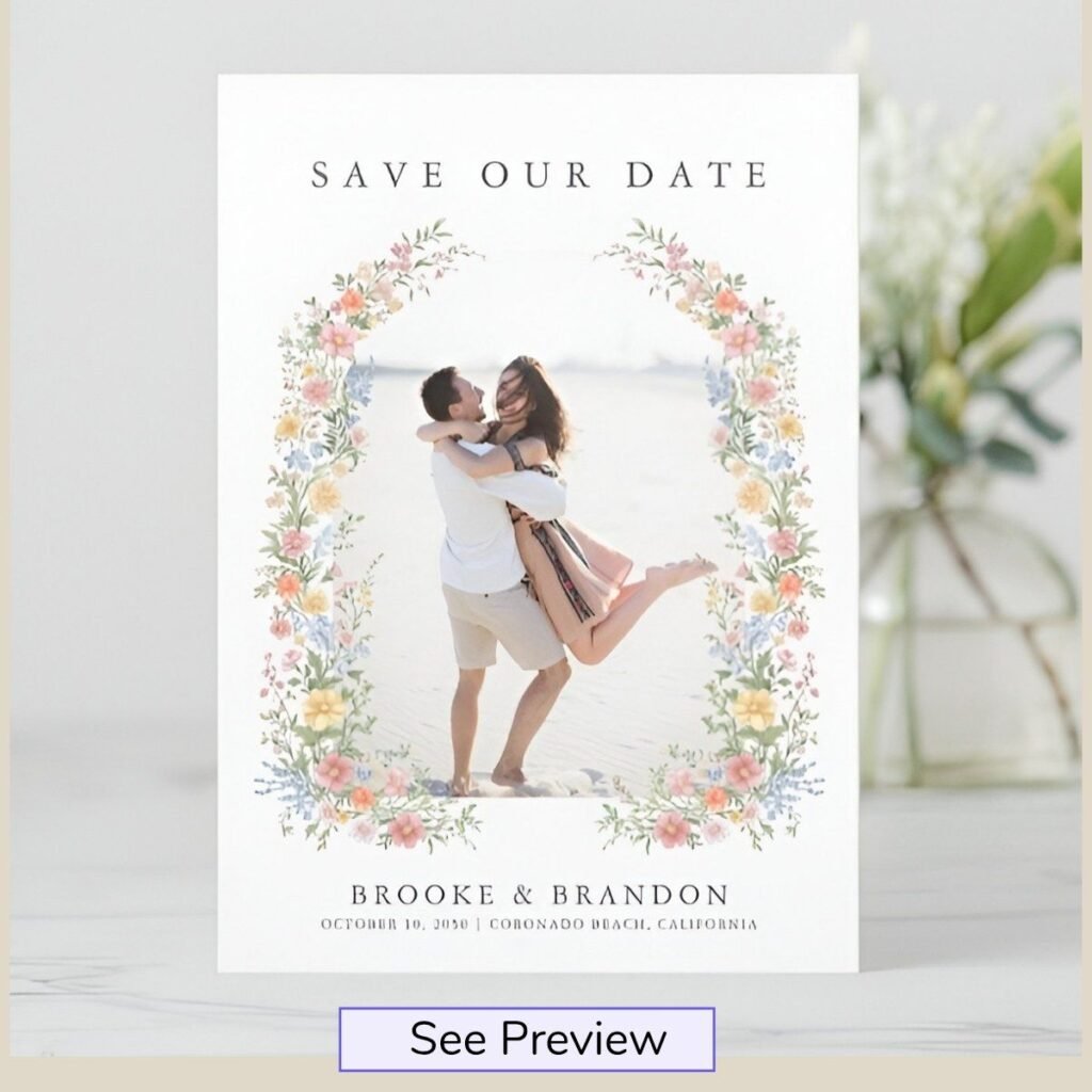 Elegant floral photo save the date card with a watercolor flower frame and personalized engagement photo.